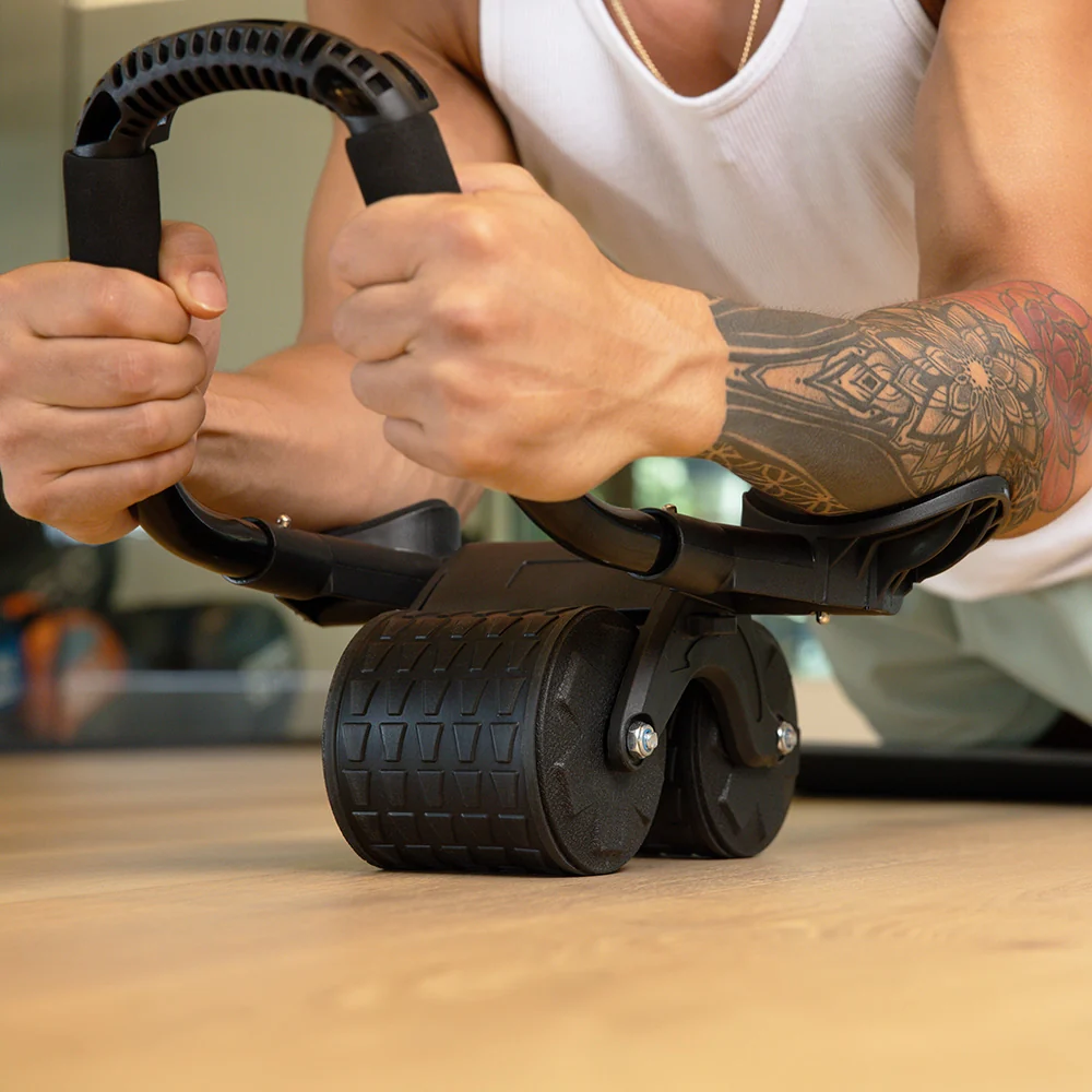 Close-up of the PostureFlex Ab Roller showing padded forearm support and two wide wheels in use